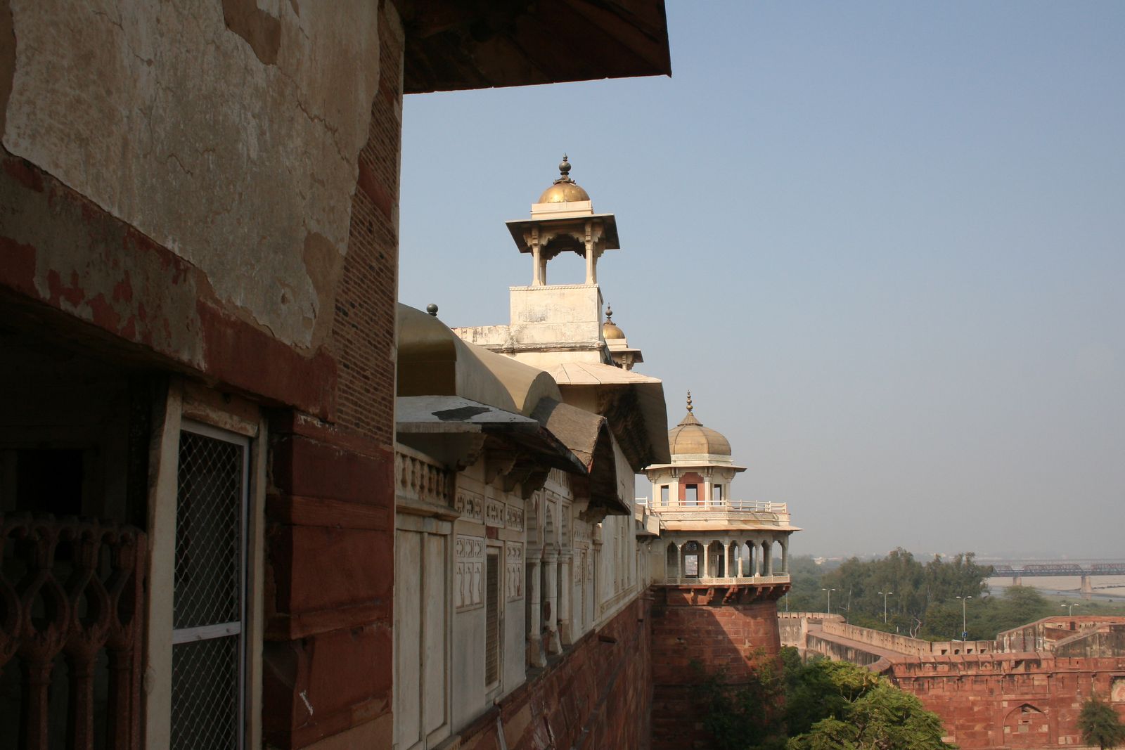 The red sandstone walls and white marble pavilions of Agra Fort above the Yamuna