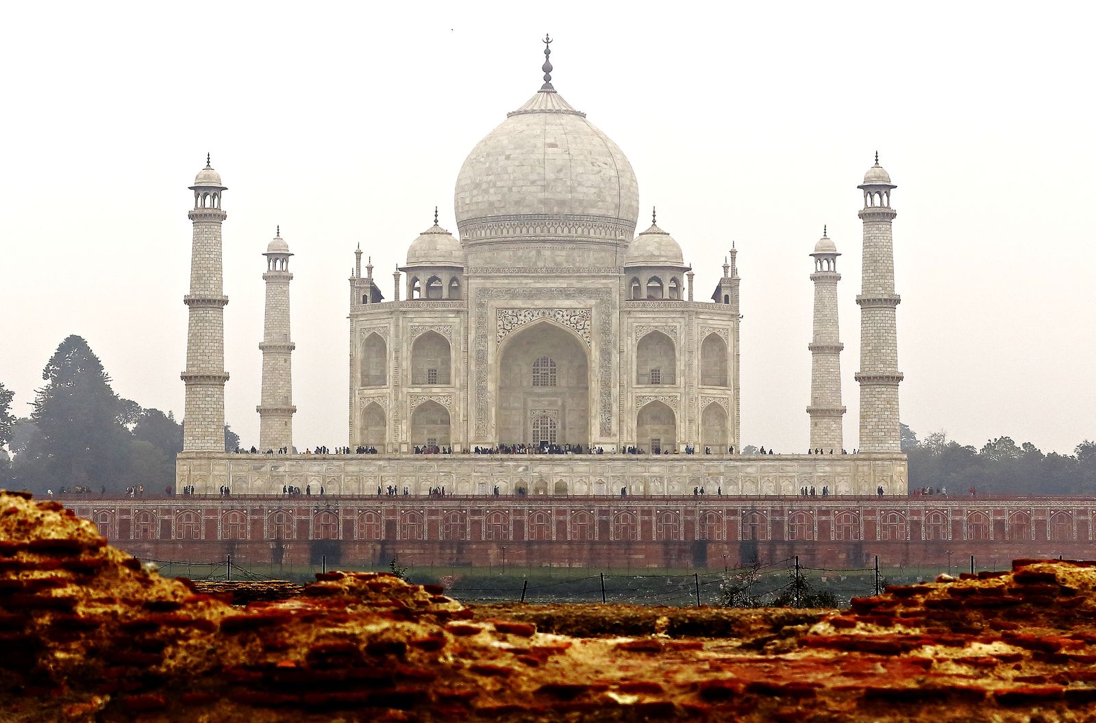 The Taj Mahal seen from the Yamuna bank through old ruined walls