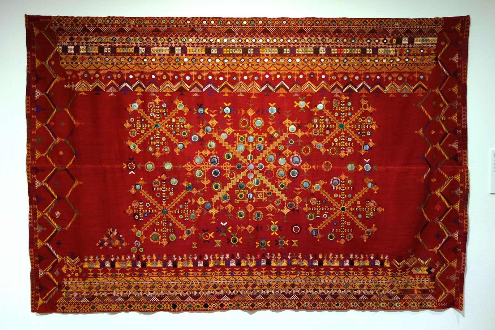 A mid-twentieth-century wedding odhni from Barmer embroidered in silk with small glass mirrors