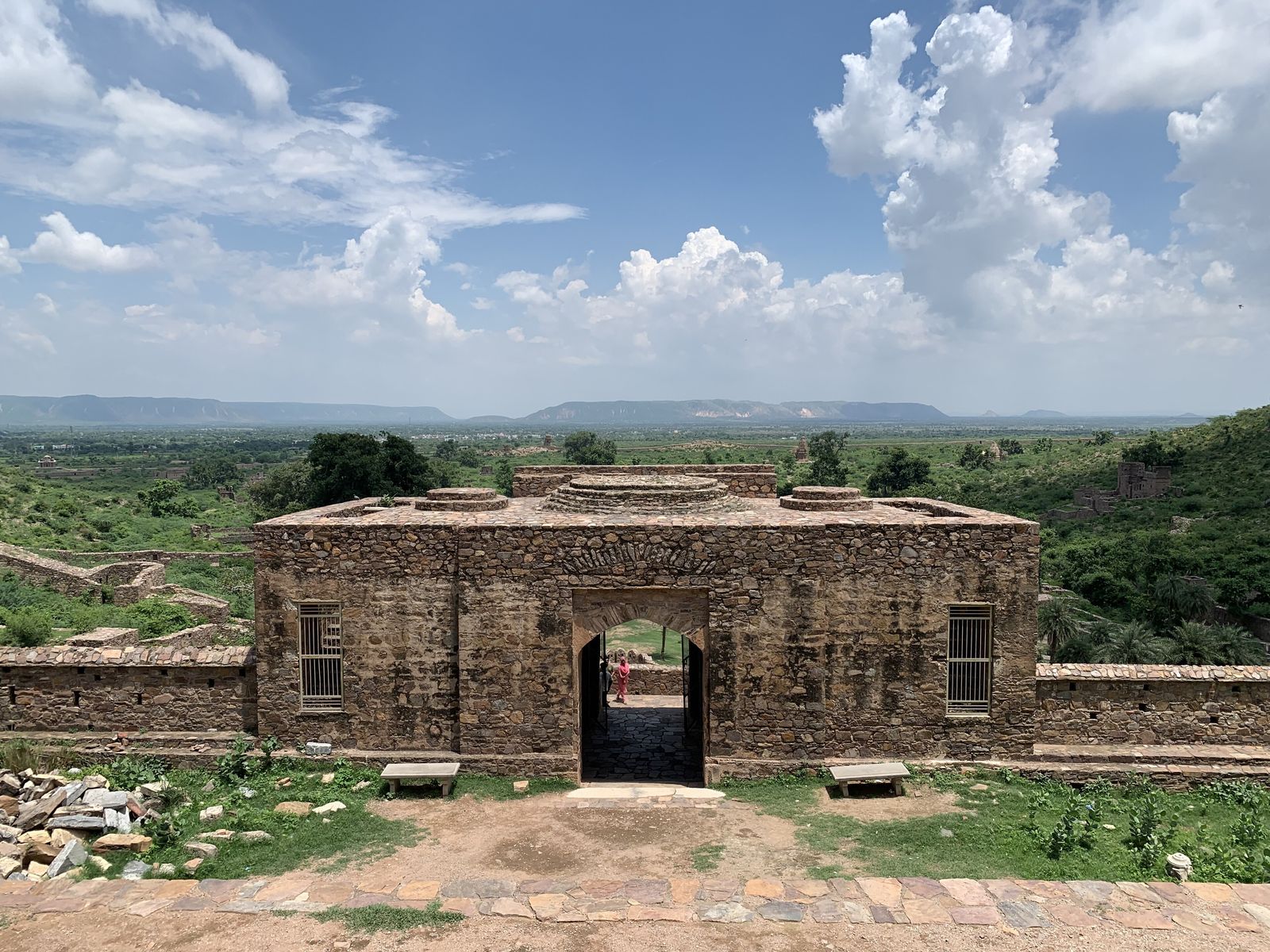 The ruined palace of Bhangarh rising in tiers against the Aravalli hills