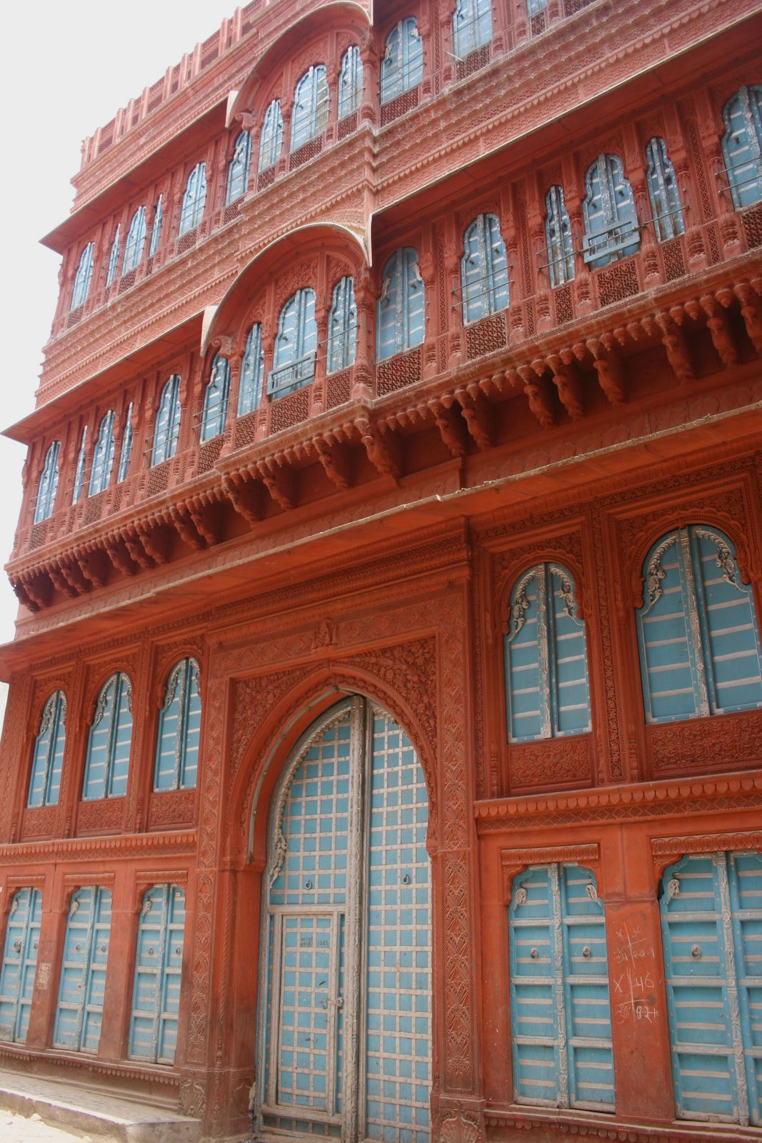 The carved red sandstone facade of Rampuria Haveli in Bikaner's old city