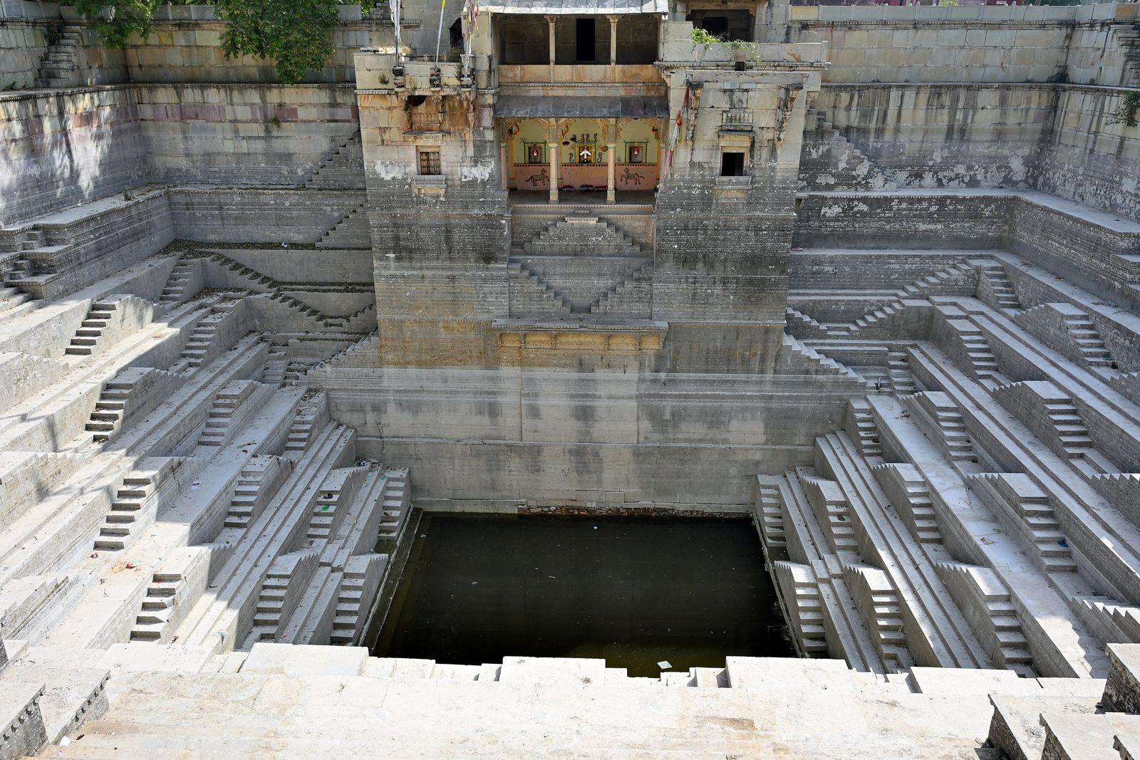 Geometric flights of stone steps descending on all sides into Dabhai Kund stepped tank in Bundi