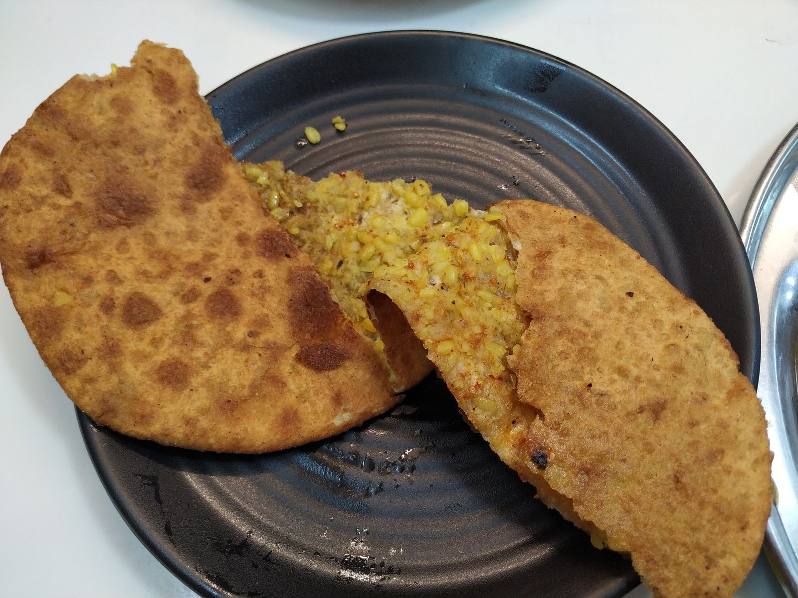 A dal paratha with chutneys and pickles from Paranthe Wali Gali off Chandni Chowk