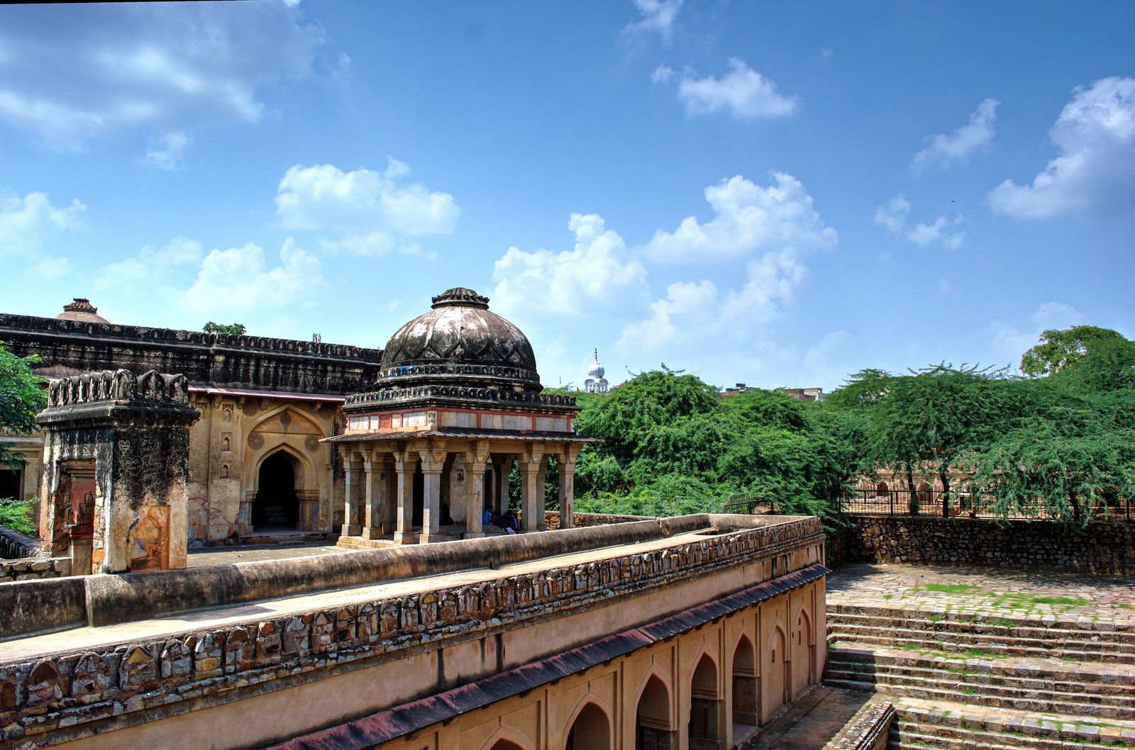 The stone steps and arched galleries of Rajon ki Baoli, a sixteenth-century stepwell in Mehrauli Archaeological Park, Delhi