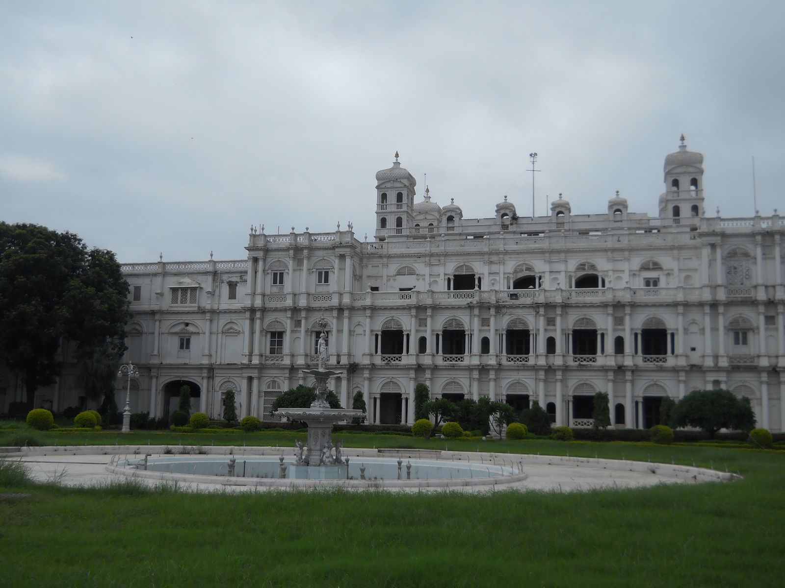 The white Italianate facade of Jai Vilas Palace in Gwalior, beside the grounds of Usha Kiran