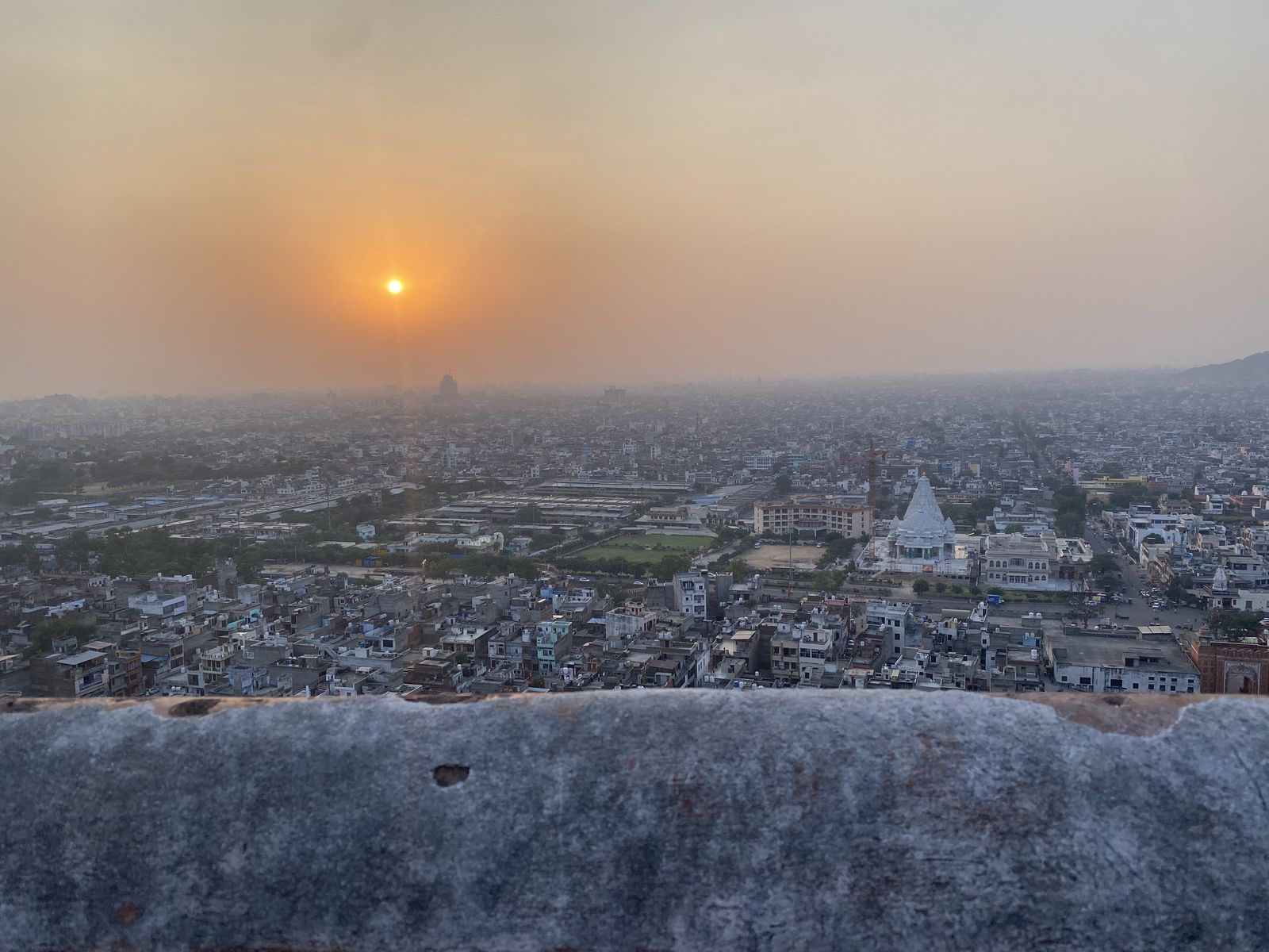 The Surya Mandir sun temple on the ridge above Galtaji, with the city of Jaipur spread out below