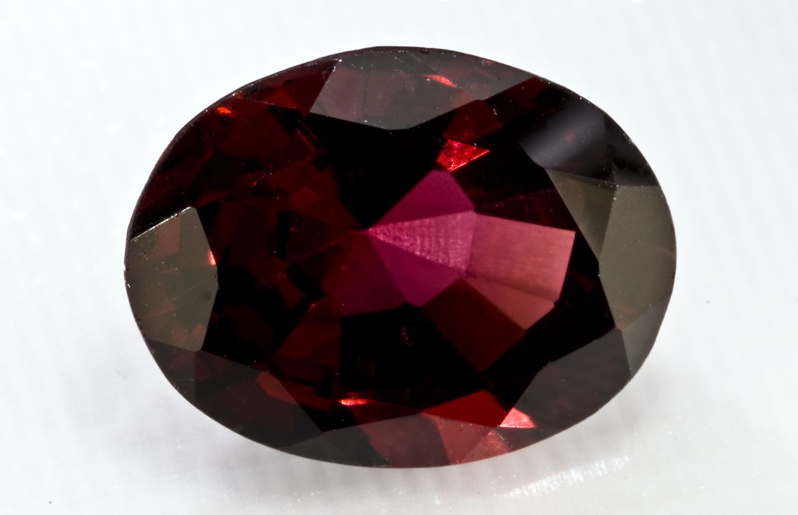 A faceted almandine garnet, one of the stones worked by Jaipur's gem cutters