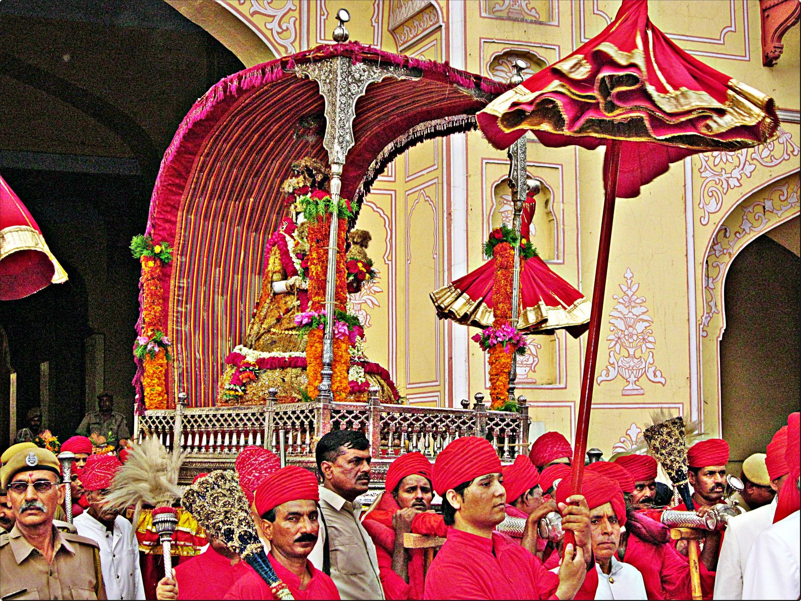 Women in green and pink leheriya saris at the Teej festival in Jaipur