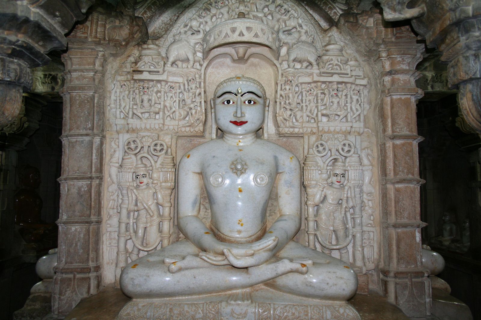 Carved yellow sandstone pillars and ceilings inside the Jain temples of Jaisalmer Fort