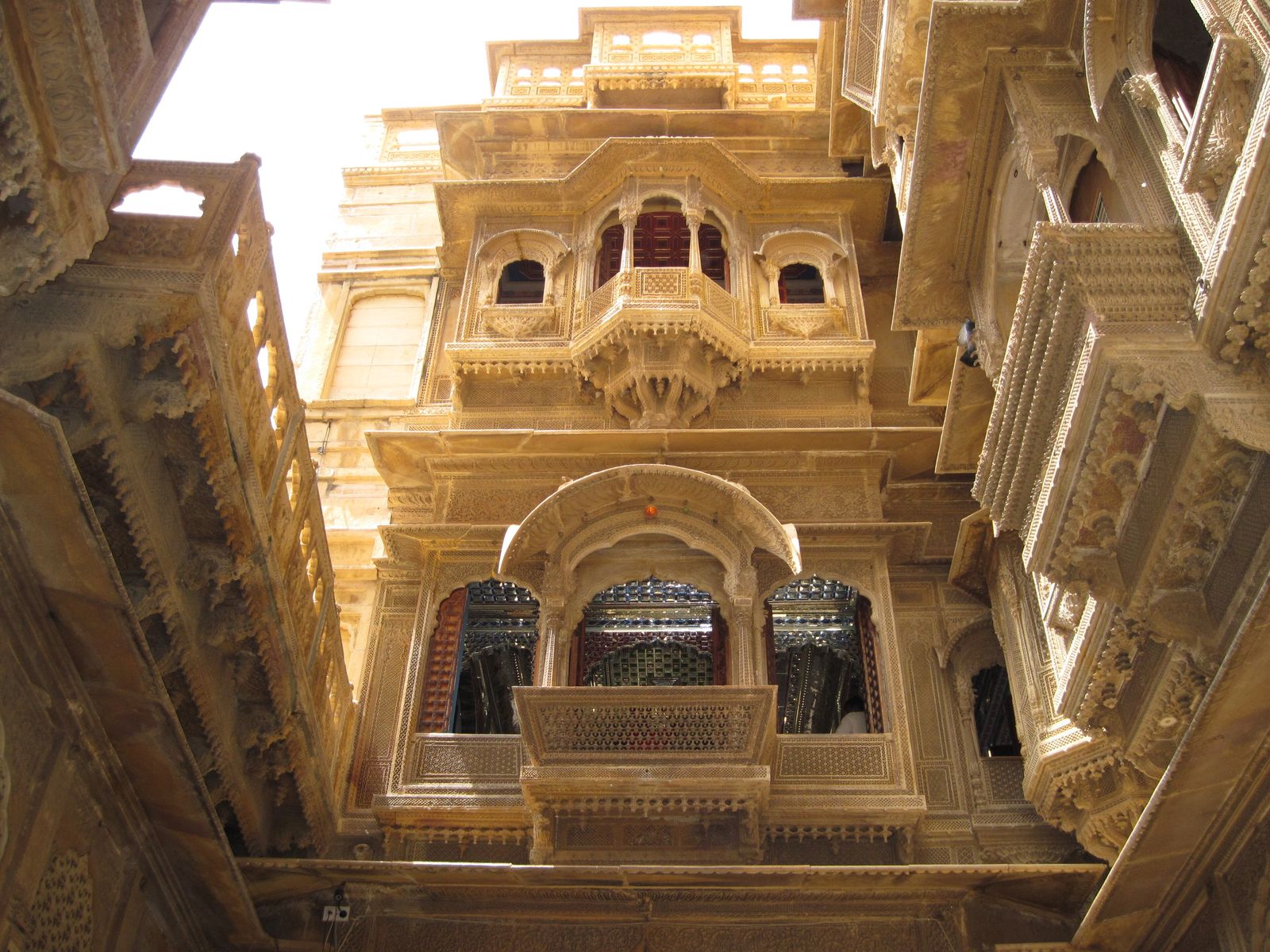 Carved yellow sandstone balconies and screens on the facade of Patwon ki Haveli in Jaisalmer