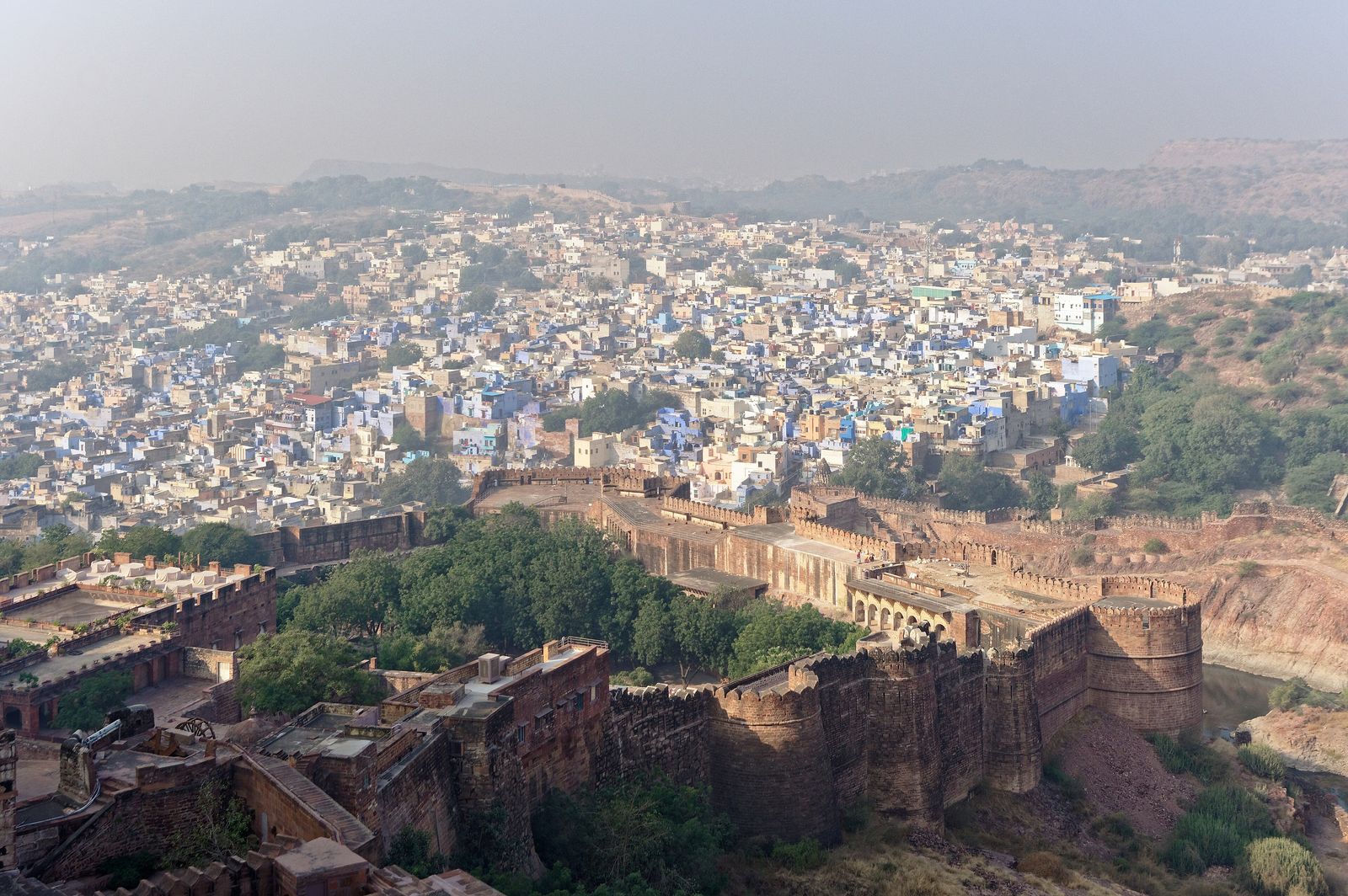 The ramparts of Mehrangarh Fort looking down over the blue houses of Jodhpur's old city
