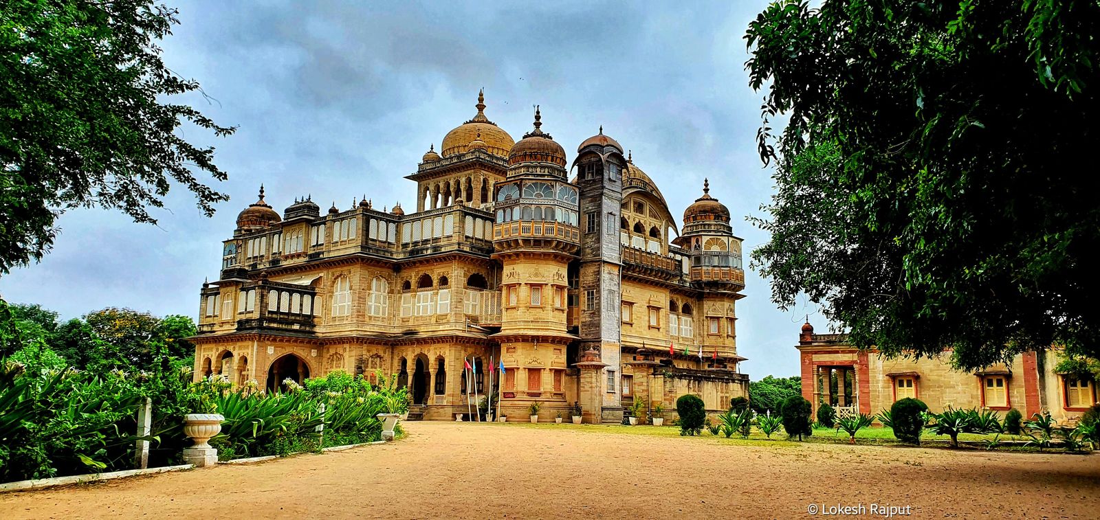The domed sandstone facade of the Vijay Vilas Palace at Mandvi set in its gardens