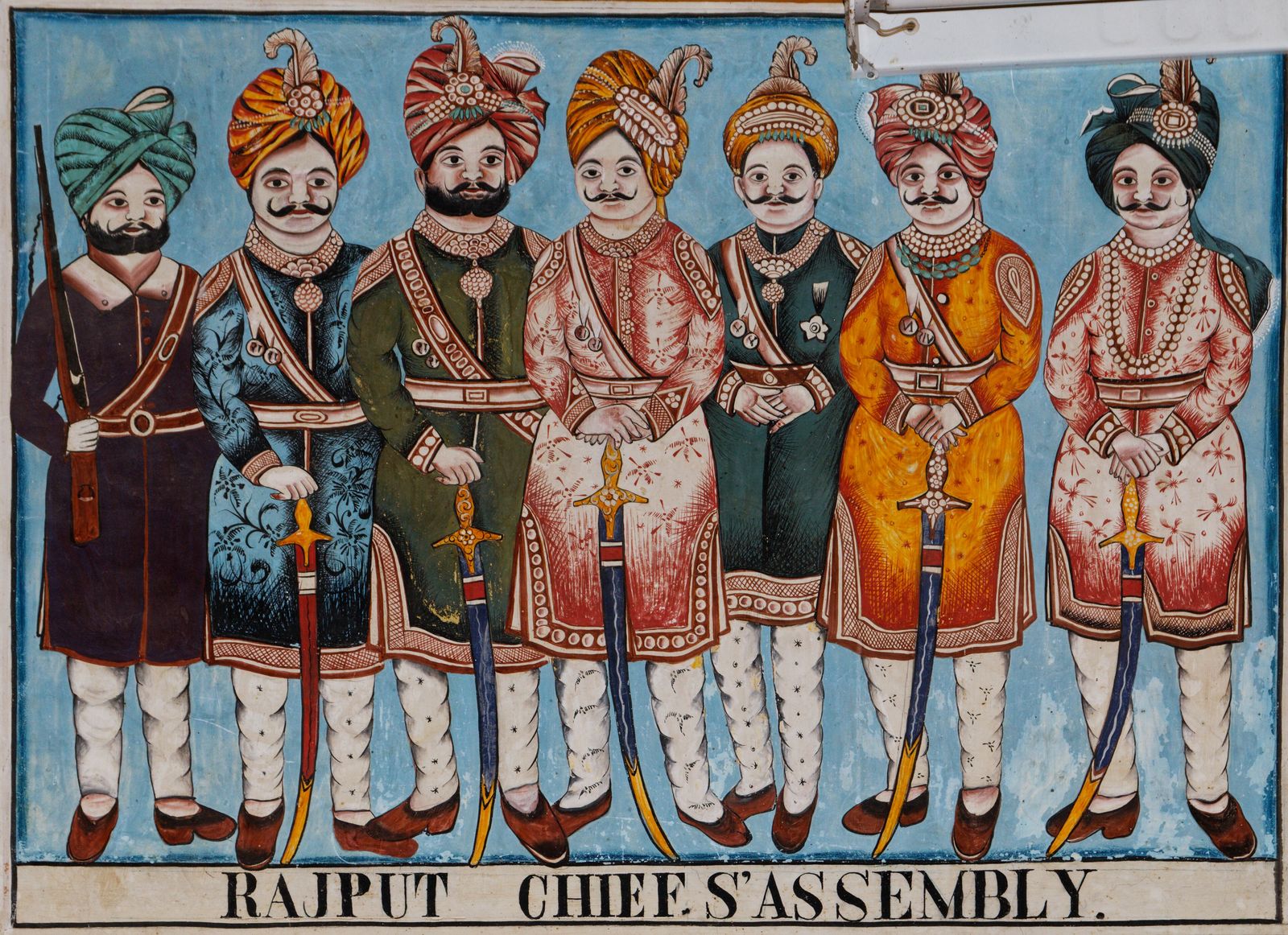 A painted mural of Rajput chiefs in assembly on a haveli wall in Mandawa