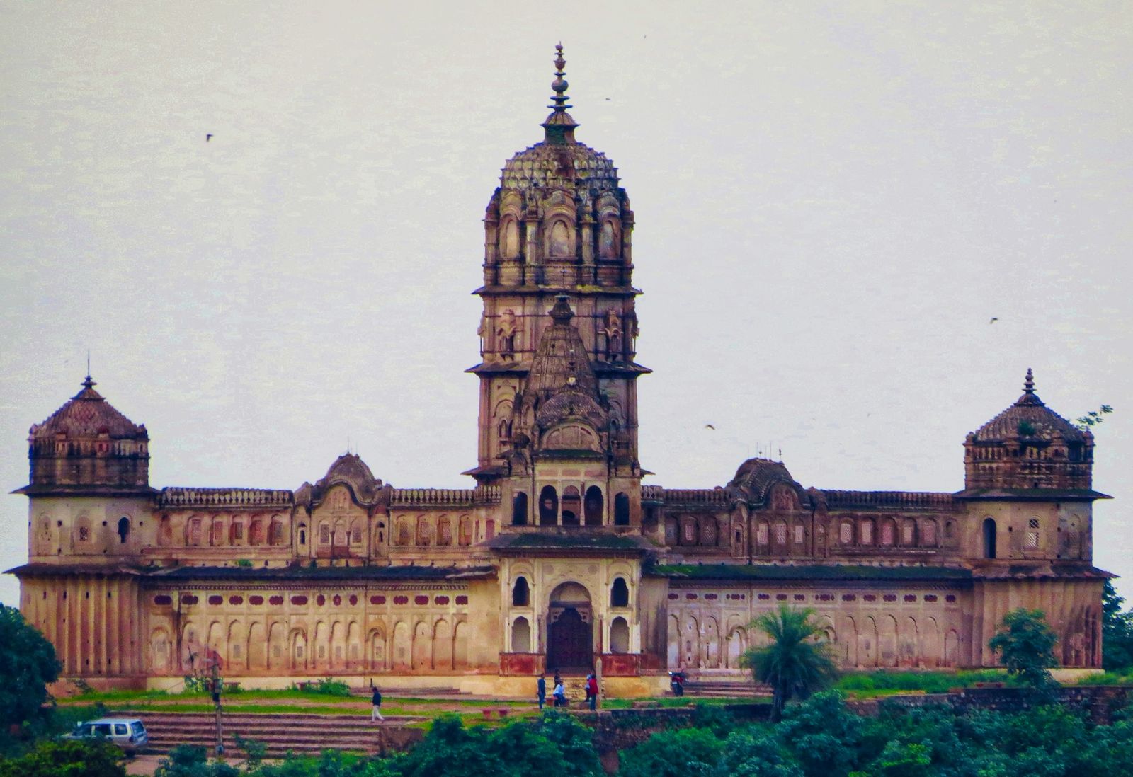 Faded murals of gods, horsemen and processions painted on the ceiling of the Laxminarayan temple in Orchha