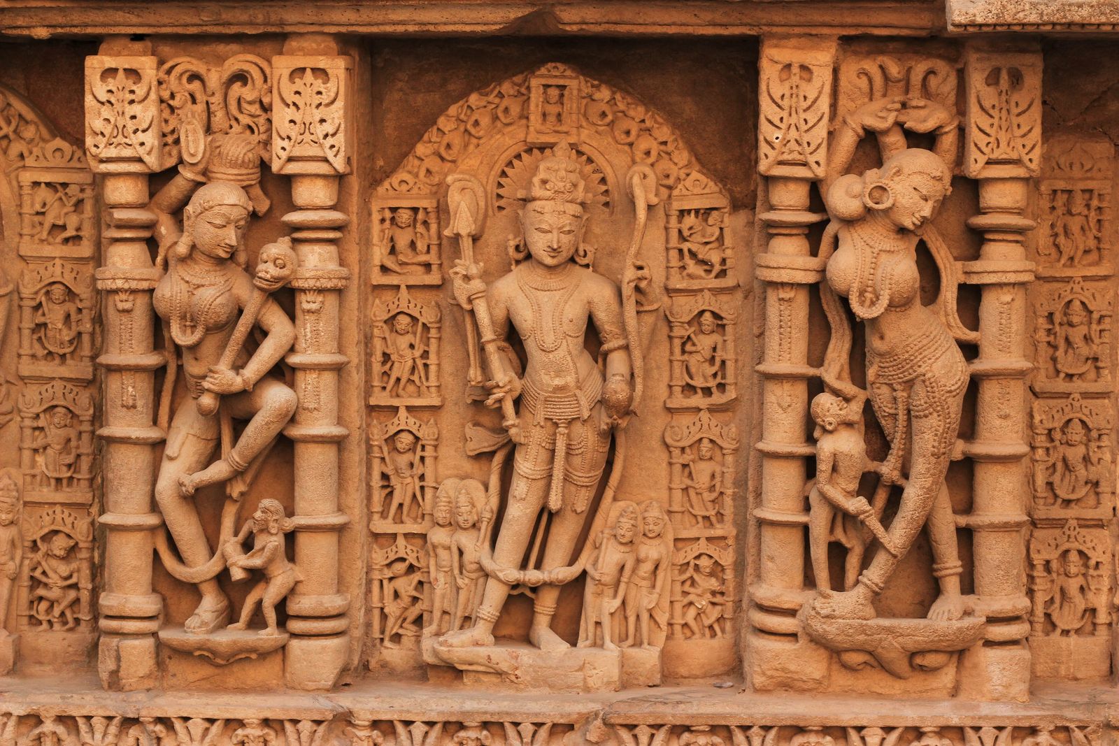 Rows of carved deities and celestial figures on the stone walls of Rani ki Vav, the queen's stepwell at Patan