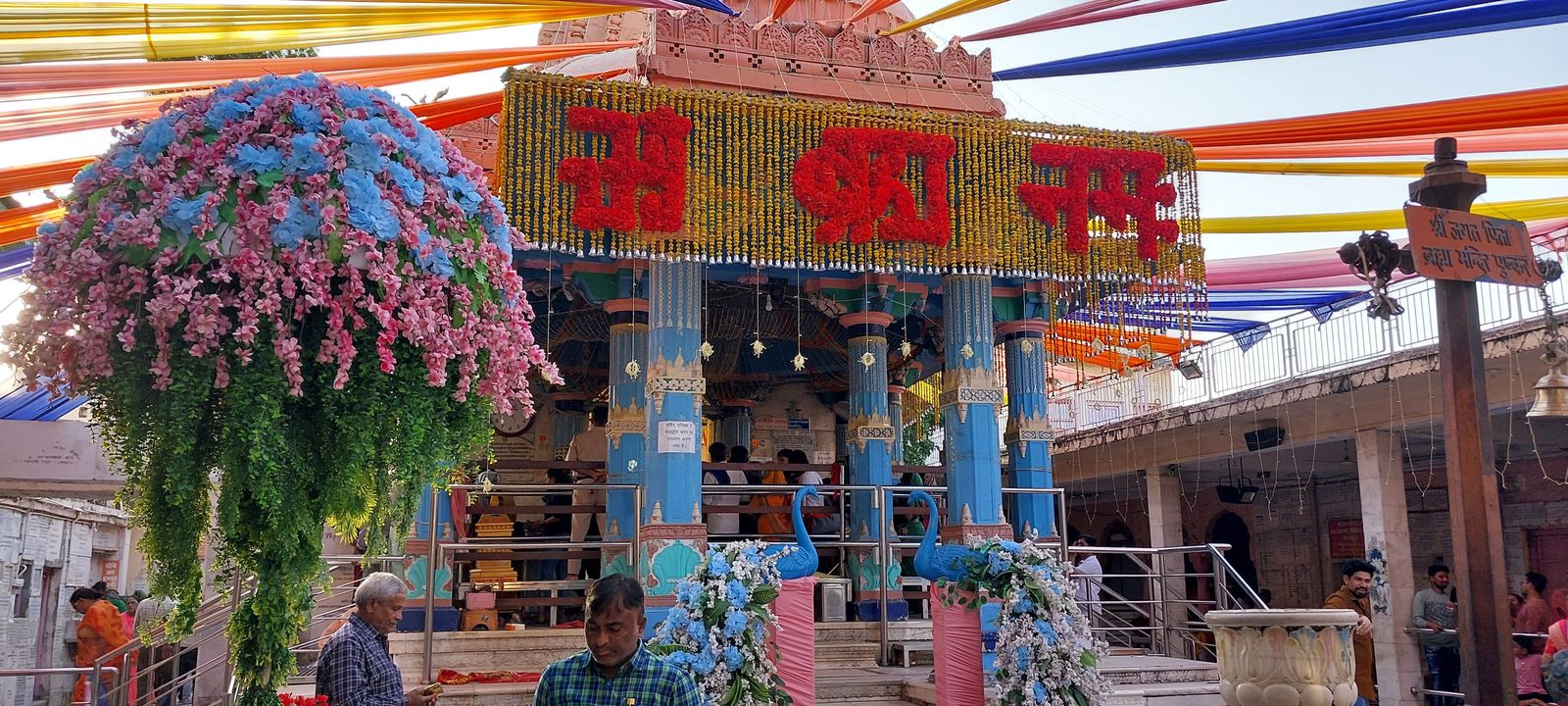 The steps and gateway of the Brahma temple in Pushkar, with pilgrims climbing barefoot