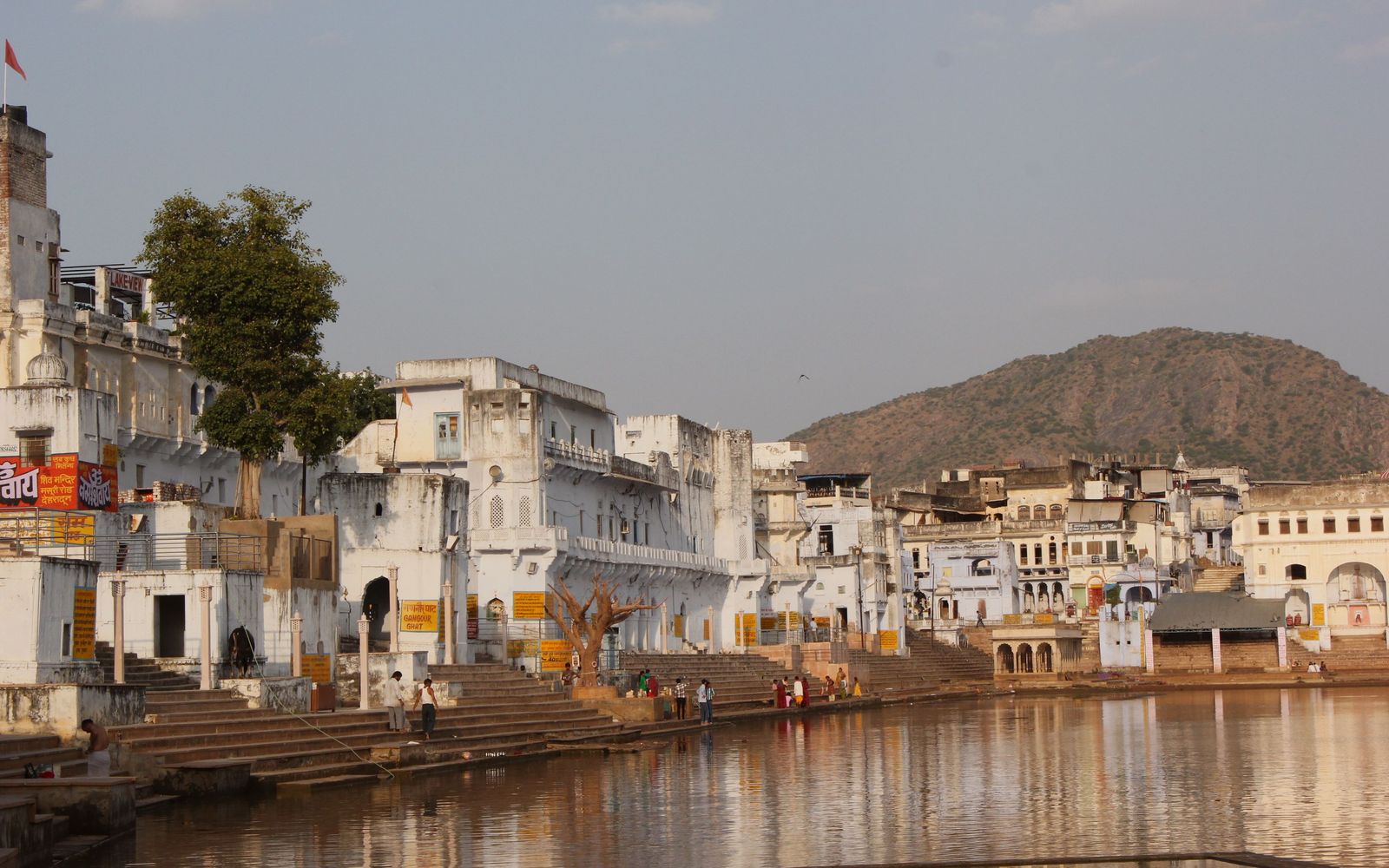 Whitewashed temples and ghats stepping down to the sacred lake at Pushkar
