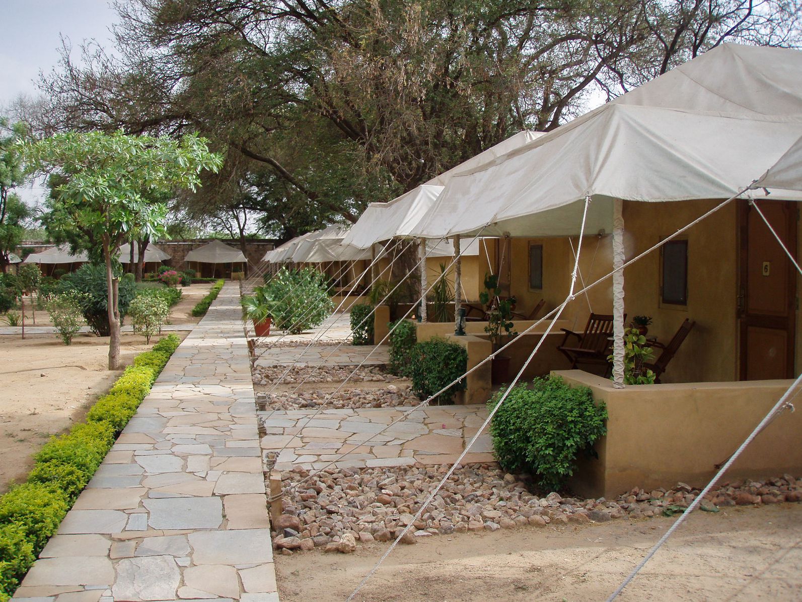 Tents and fountains along the water channels of the walled Mughal-style garden of Samode Bagh