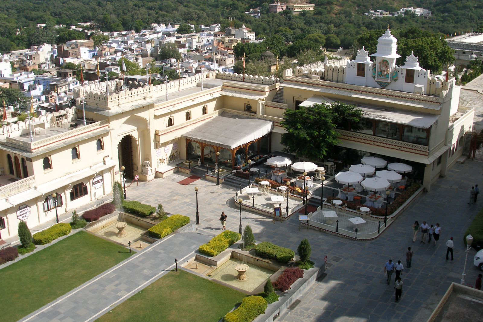 An inner courtyard of the City Palace in Udaipur, with carved balconies around a paved court