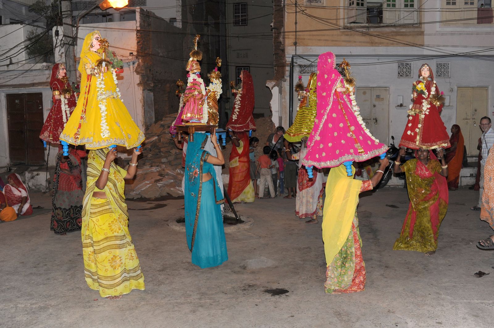 Women carrying Gangaur idols during the festival in Udaipur