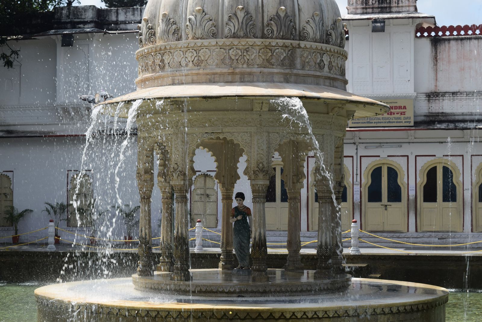 A lotus pool with a central marble kiosk and fountains in the Saheliyon ki Bari garden in Udaipur